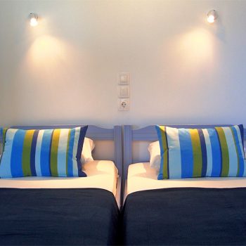 Second bedroom has 3 identical single beds.